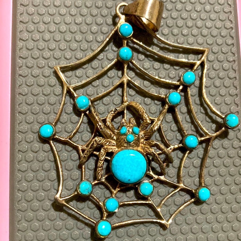 Sterling silver spider in a web with turquoise stones
